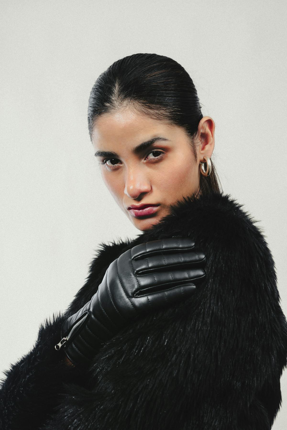 Black Karakul fur coat editorial portrait