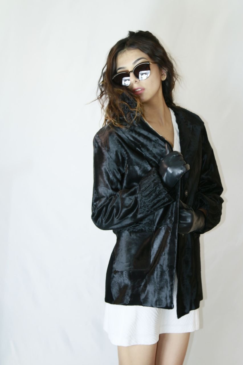 Black Karakul fur jacket studio editorial
