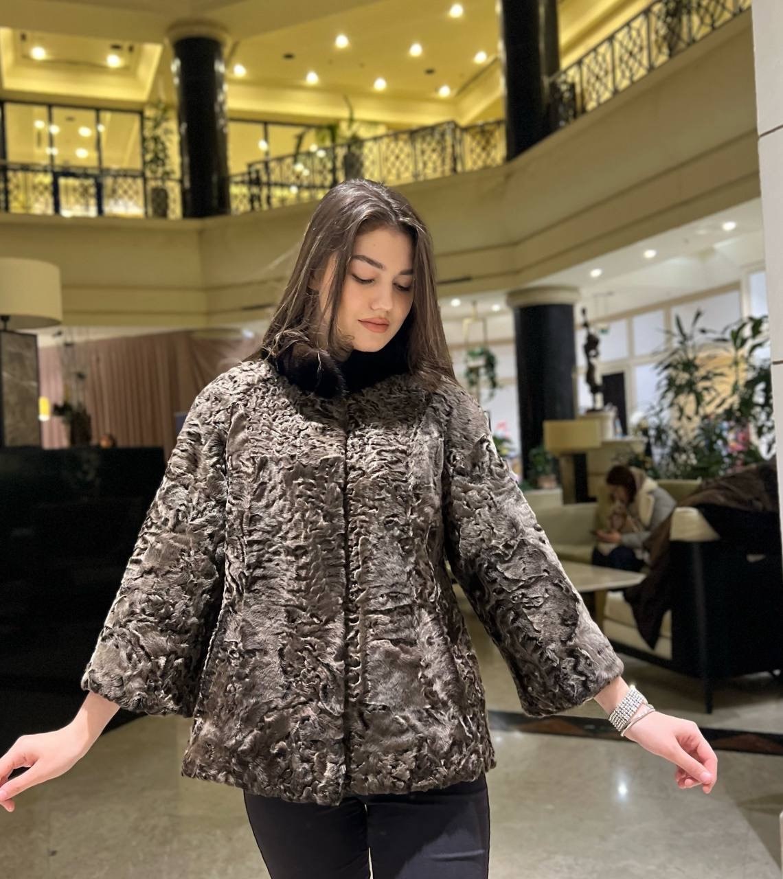 Grey Karakul fur jacket in lobby